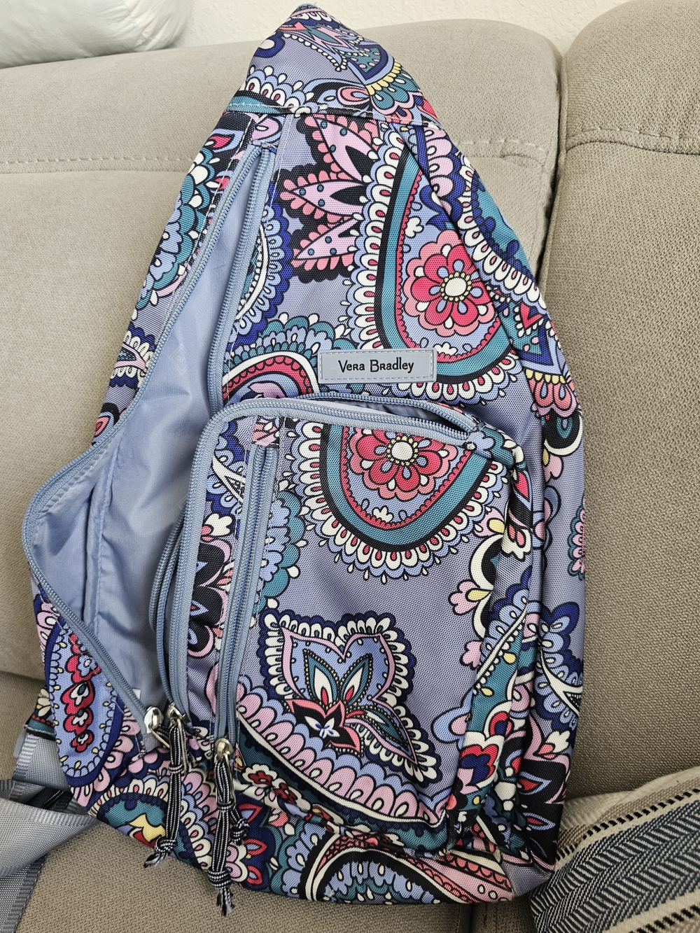 Vera Bradley Lighten Up Sling Backpack in the vibrant Kona Paisley